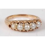 A yellow metal and cultured pearl half eternity ring, the five pearls each measuring approx 3.5mm,