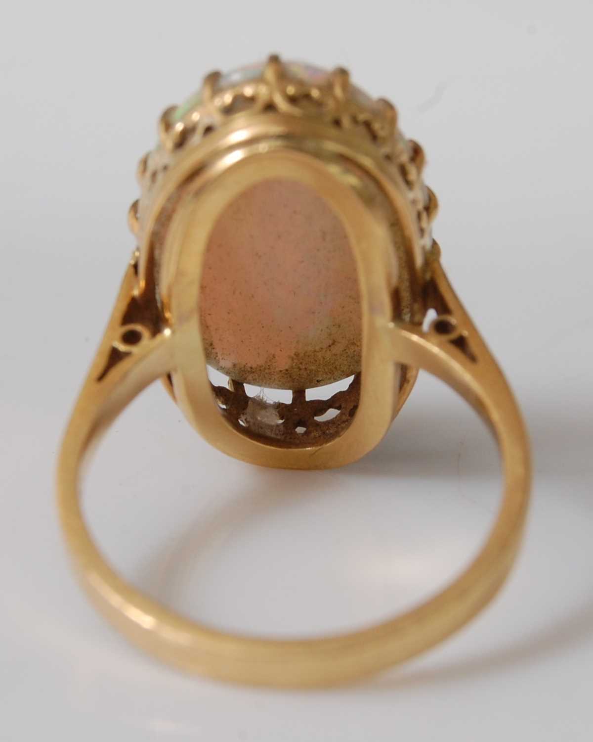 An 18ct yellow gold oval opal dress ring, the cabochon cut opal measuring approx 20.2 x 13.0 x 3. - Image 4 of 6