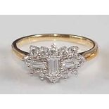 An 18ct yellow and white gold diamond oblong cluster ring, comprising three centre baguette cut