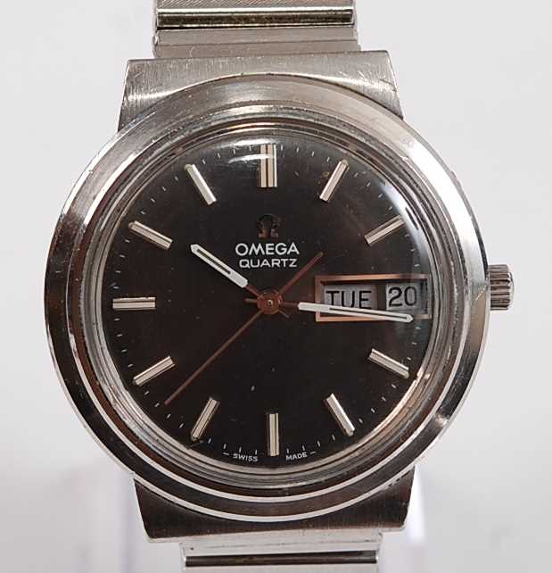 A Gents stainless steel Omega Mega-Quartz wristwatch, with round black baton dial and day/date at - Image 2 of 3