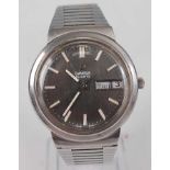 A gent's 1970s Omega stainless steel quartz wristwatch, having a signed dial, baton markers, day/