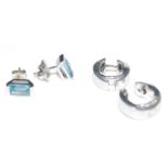 A cased pair of Mont Blanc silver and blue topaz ear studs, the baguette cut topaz each measuring