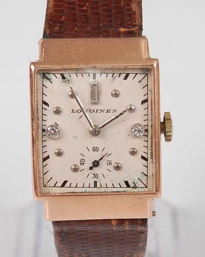 A vintage gent's Longines 14ct gold cased tank watch, having a signed silvered dial with
