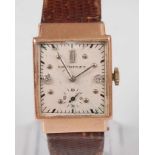 A vintage gent's Longines 14ct gold cased tank watch, having a signed silvered dial with