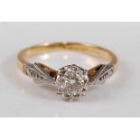 An 18ct and platinum diamond single stone ring, the round brilliant cut diamond in an illusion