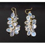 A pair of yellow metal moonstone multi-drop earrings, each featuring seventeen oval cabochon cut