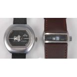 A Prestige gent's brushed steel cased jump-hour wristwatch, the signed black dial with subsidiary