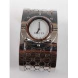 A lady's stainless steel Gucci 'Twirl' bangle wristwatch, with reversible dial, case diameter
