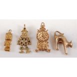 Four assorted 9ct yellow gold charms, comprising: an engraved carriage clock with moveable hands, 29