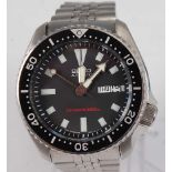 A gent's Seiko divers 200m steel cased automatic wristwatch, having a signed black dial with