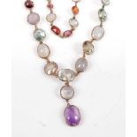 A yellow metal two row multi-stone necklace, featuring amethyst, aquamarine, garnet, topaz, citrine,