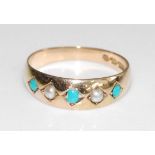 A late Victorian 15ct yellow gold half hoop ring, having three turquoise cabochons and two seed