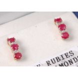 A pair of contemporary 9ct gold, ruby and diamond ear studs, each having three round cut four-claw