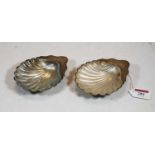 A pair of Victorian silver shell shaped butter dishes, each having glass liner, 4.9oz (excluding