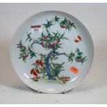 A Chinese export porcelain shallow bowl, enamel decorated with a fruiting tree, having red seal mark