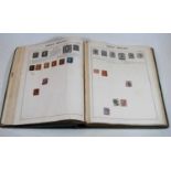 The Challenge stamp album containing a good quantity of stamps from around the world to include