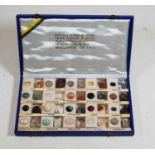 A box of assorted Brazilian semi precious stones to include topaz, smoked quartz, garnet,