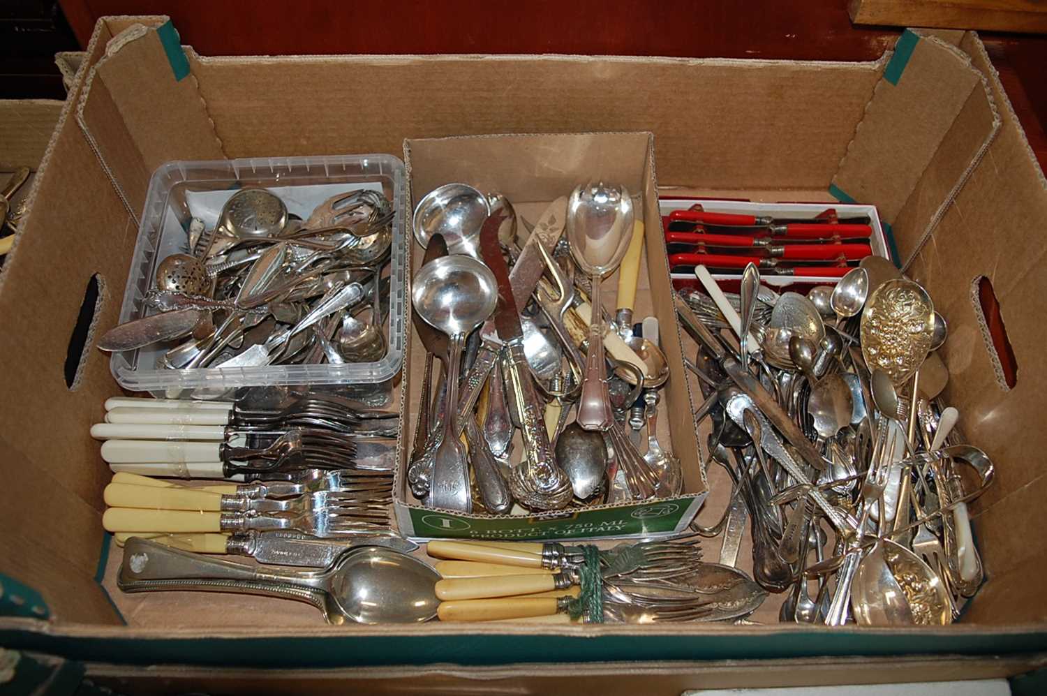 A box of miscellaneous silver plated loose flatware, various dates, makers and patterns