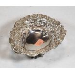 A late Victorian silver bonbon dish, having a heart shaped centre within pierced and C-scrolling