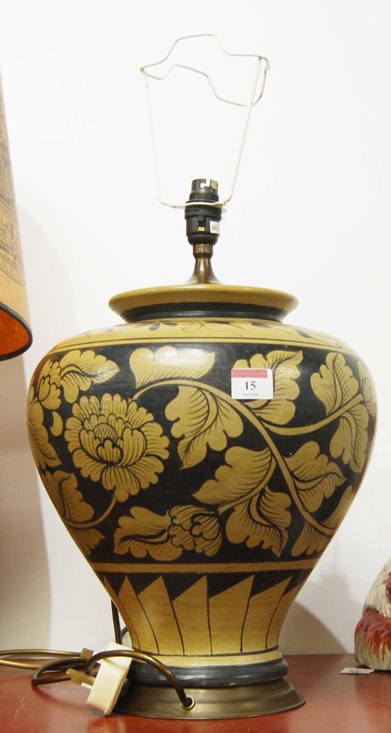 A 20th century pottery table lamp of squat baluster form, decorated with foliage, height 55cm