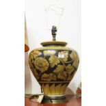 A 20th century pottery table lamp of squat baluster form, decorated with foliage, height 55cm