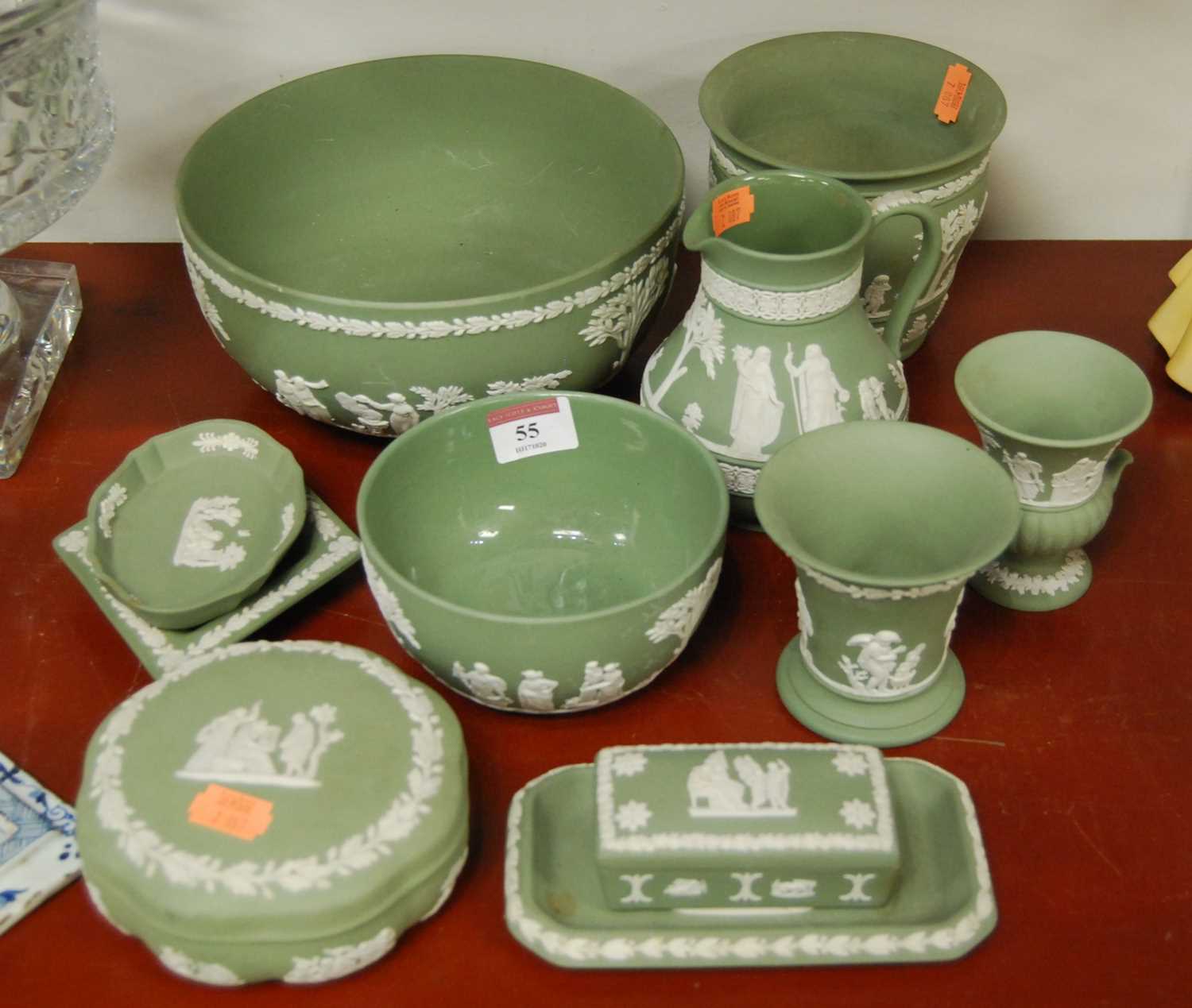 A collection of Wedgwood green jasper ware to include a small water jug, a pin tray, spill vase,