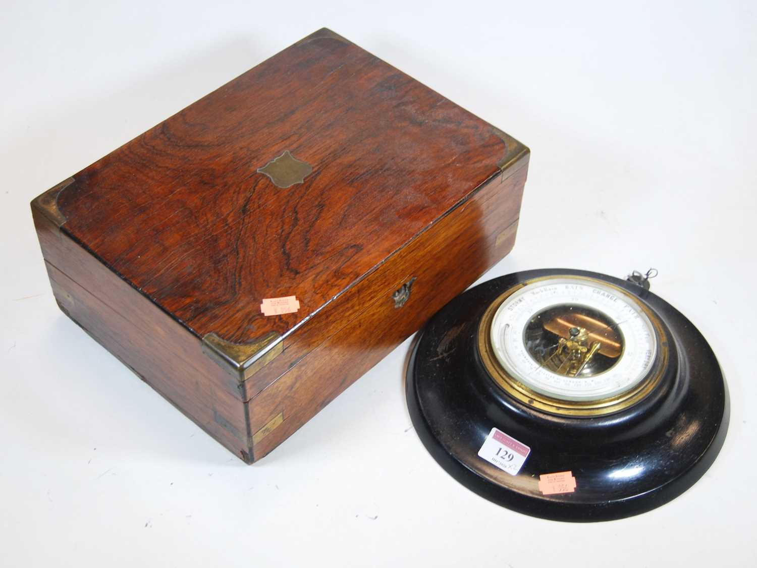 A mid 19th century rosewood box with inset brass cartouche and corners, width 30cm,together with