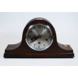 A 1930s oak cased Nelsons hat mantel clock, the silvered dial showing Arabic numerals, eight day