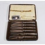 A cased set of six George V tea knives each having steel blades and silver mounted handles, together