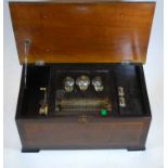 A Victorian walnut cased cylinder music box with 6" cylinder, change/repeat lever, and stop/play