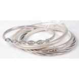 Four various silver bangles, 39g