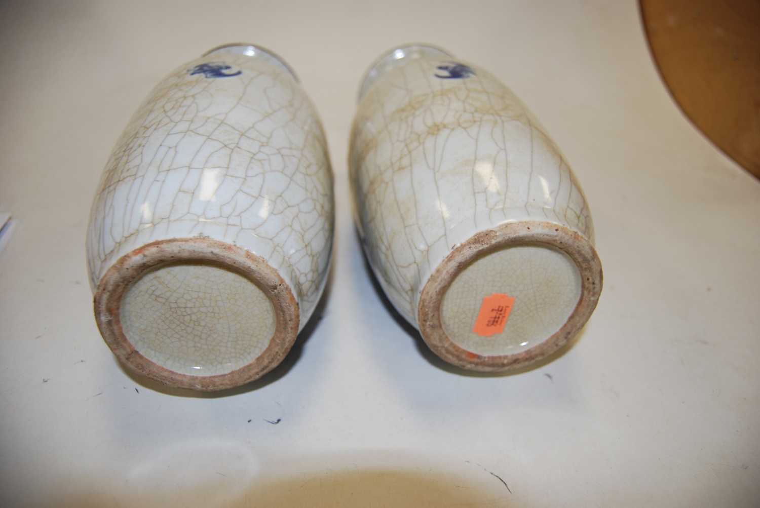 A pair of 20th century Chinese blue & white crackle glazed vases, with flared rims, the ovoid body - Image 6 of 6