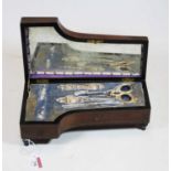 A Victorian lady's rosewood and pewter inlaid needlework box, in the form of a grand piano, the