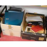Two boxes containing a large collection of stamps, mainly housed in binders and albums