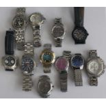 A collection of gents quartz and automatic steel cased fashion watches, many with steel bracelets (