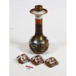 A Japanese Meiji period kutani candlestick having slender neck to bulbous lower body decorated