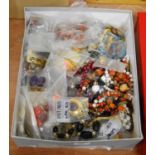 A box of assorted costume jewellery to included beaded necklaces, ear pendants etc
