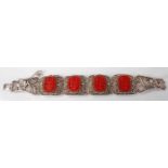 A modern Chinese filigree worked and cinnabar lacquer inset hinged bracelet, 17cm
