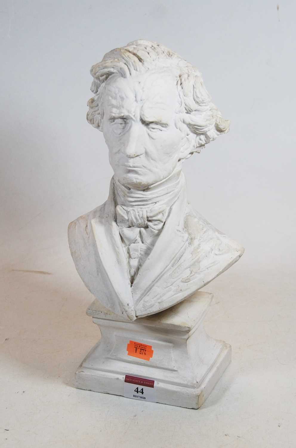 A plaster shoulder length bust of Hector Berlioz 1803-1869 on a cavetto moulded plinth, height 31cm,