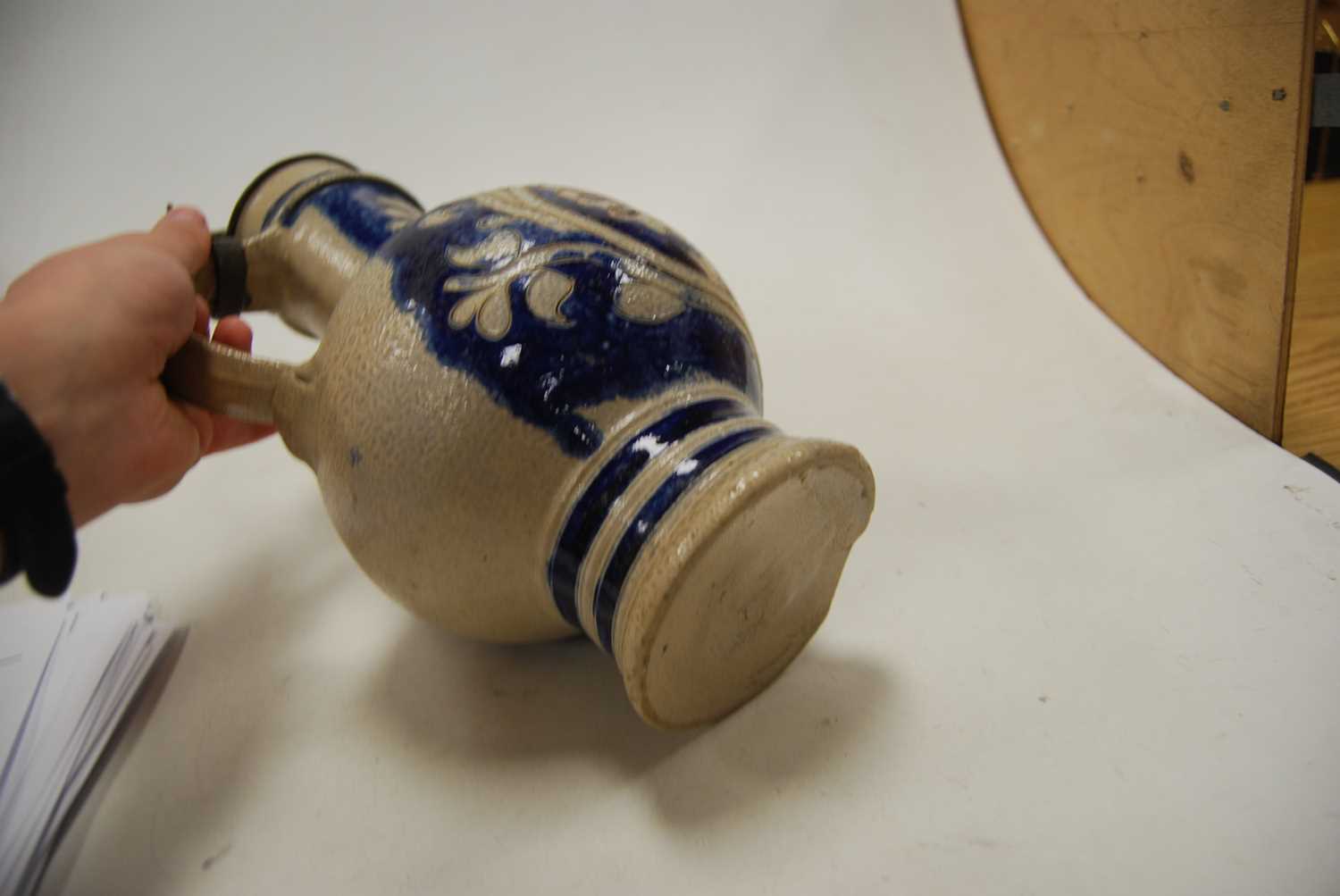 A German Westerwald stoneware jug, with pewter lid and thumb rest decorated in blue with a crucifix, - Image 13 of 14