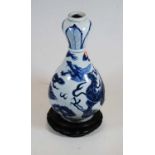 A Chinese export blue & white vase, the onion shaped neck above a baluster shaped body, decorated