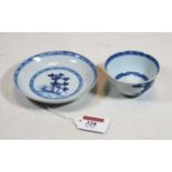 An 18th century Chinese export tin glazed blue & white tea bowl and saucer, bearing a label verso