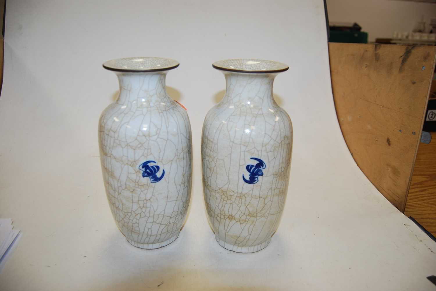 A pair of 20th century Chinese blue & white crackle glazed vases, with flared rims, the ovoid body - Image 4 of 6