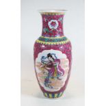A 20th century Chinese porcelain famille rose vase of baluster form, decorated with figures within a