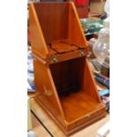 A 20th century walnut table top drinks cabinet, the hinge lid lifting to reveal a fitted interior,