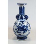 A Chinese export blue & white glazed baluster shaped vase, decorated with a four clawed dragon,