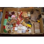 A box of assorted dolls house furniture largely being wooden, both natural and painted