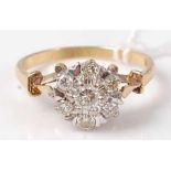 A modern 18ct gold diamond flowerhead cluster ring, total diamond weight estimated as approx 0.75