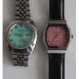 A gents Ricoh 9 1970s steel cased automatic wrist watch having day date aperture, turquoise dial and