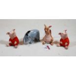 Four Beswick Walt Disney production Winnie the Pooh figures, to include Piglet x2, Eeyore, and Kanga